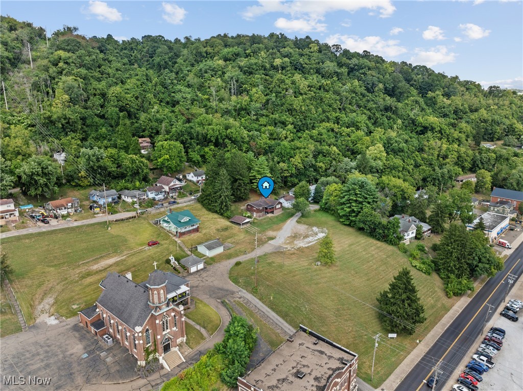 8 Spring Street Bridgeport, OH 43912 - Photo 31 of 34 Aerial view of property and surrounding area with a forest