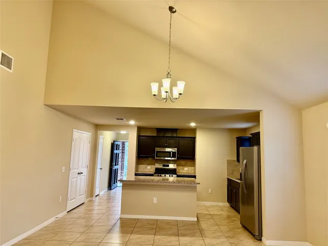 a large bathroom with a sink and a large mirror