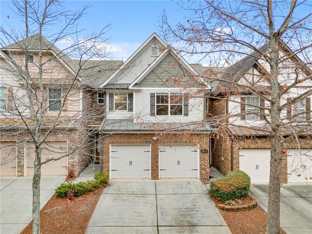 2897 Smith Ridge Trace Peachtree Corners, GA 30071 - Photo 1 of 1 a front view of a house with a yard