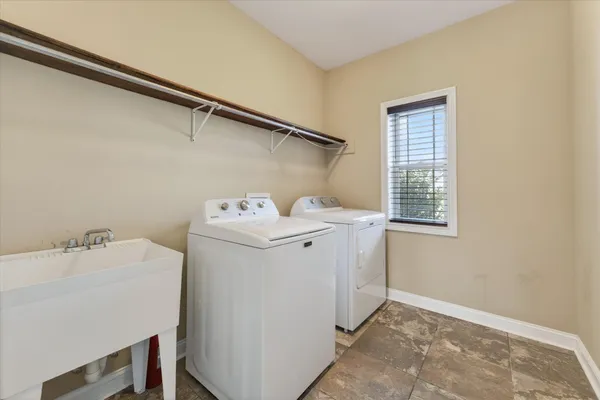 a utility room with dryer and washer