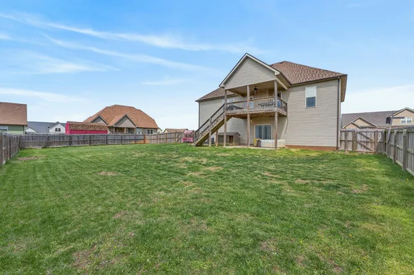 a view of a house with a big yard
