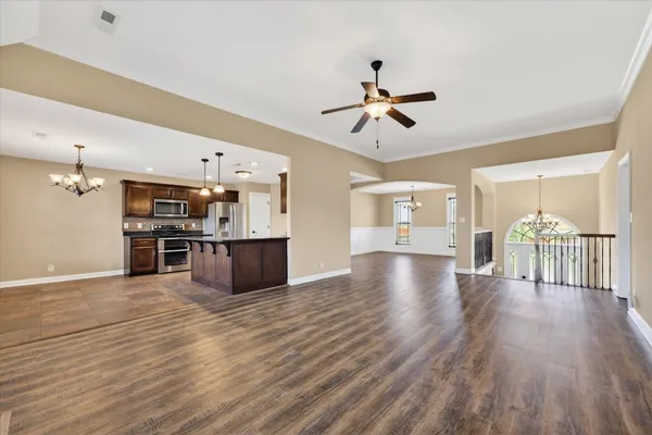 a view of a kitchen with a stove cabinets