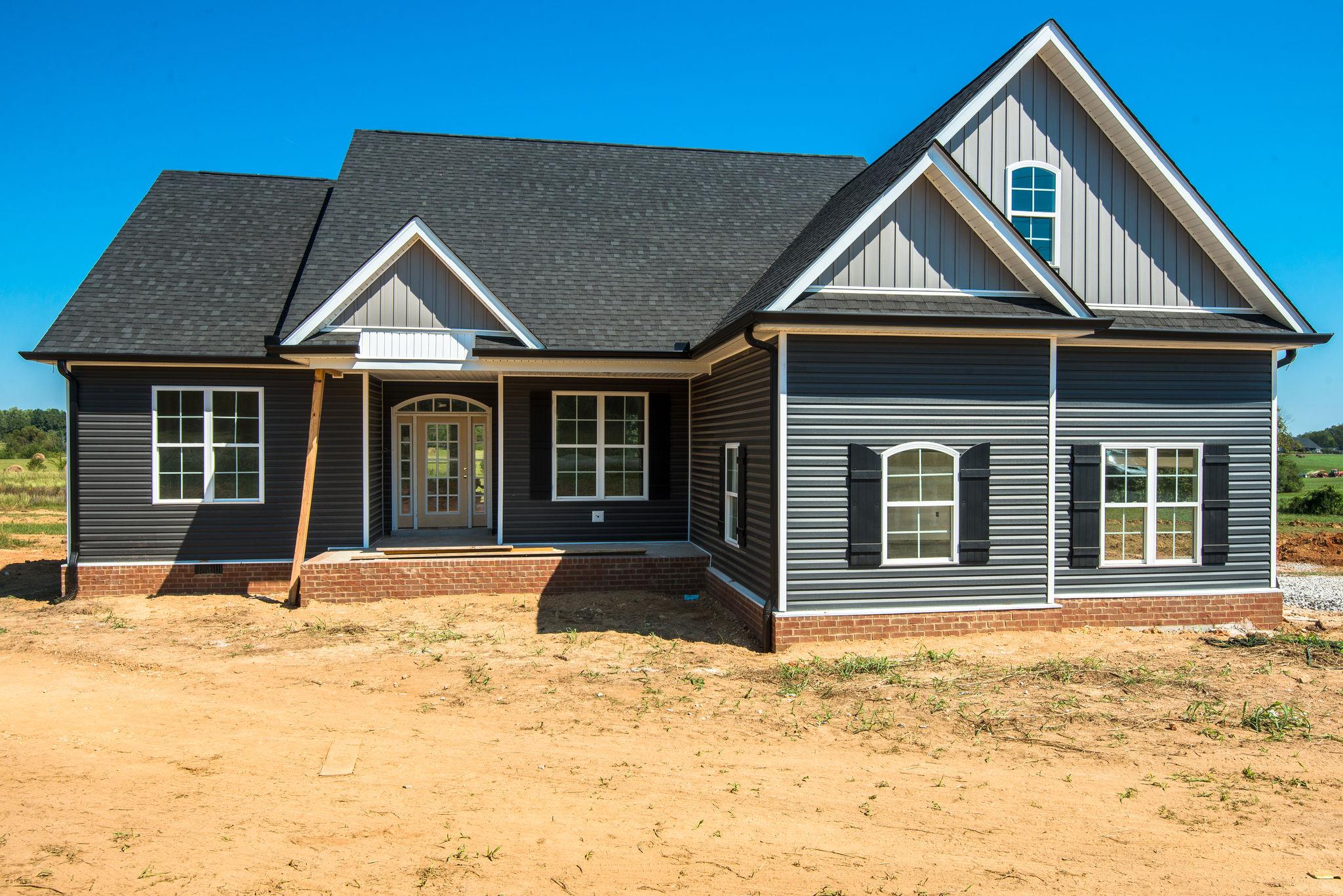 1807 Abiff Road Burns, TN 37029 - Photo 1 of 28 a front view of a house with a yard
