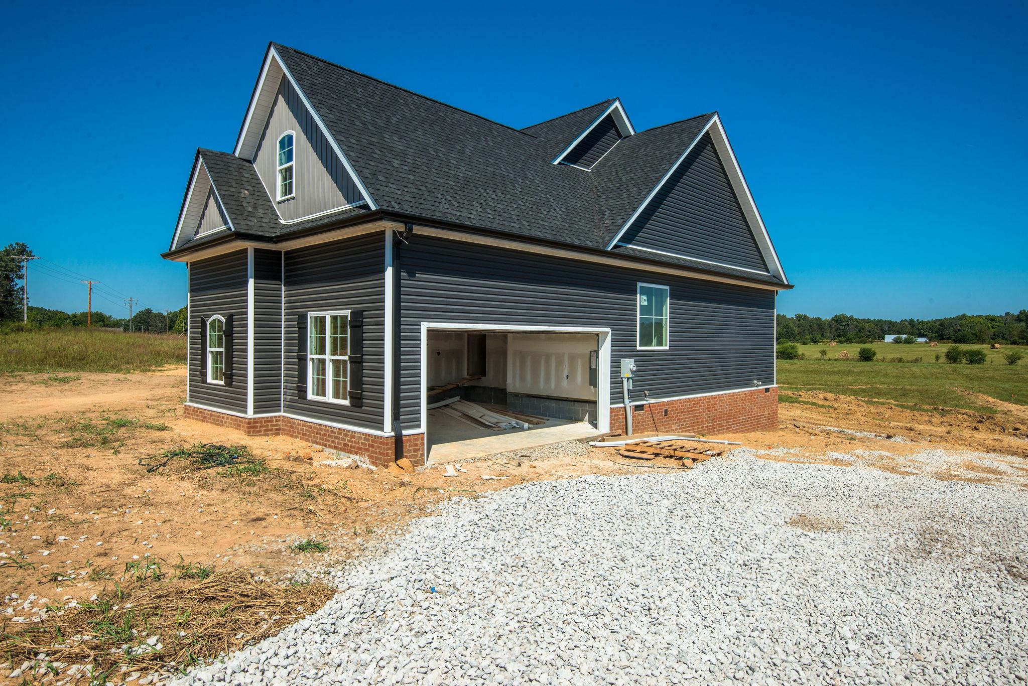 1807 Abiff Road Burns, TN 37029 - Photo 11 of 28 a front view of a house with a yard