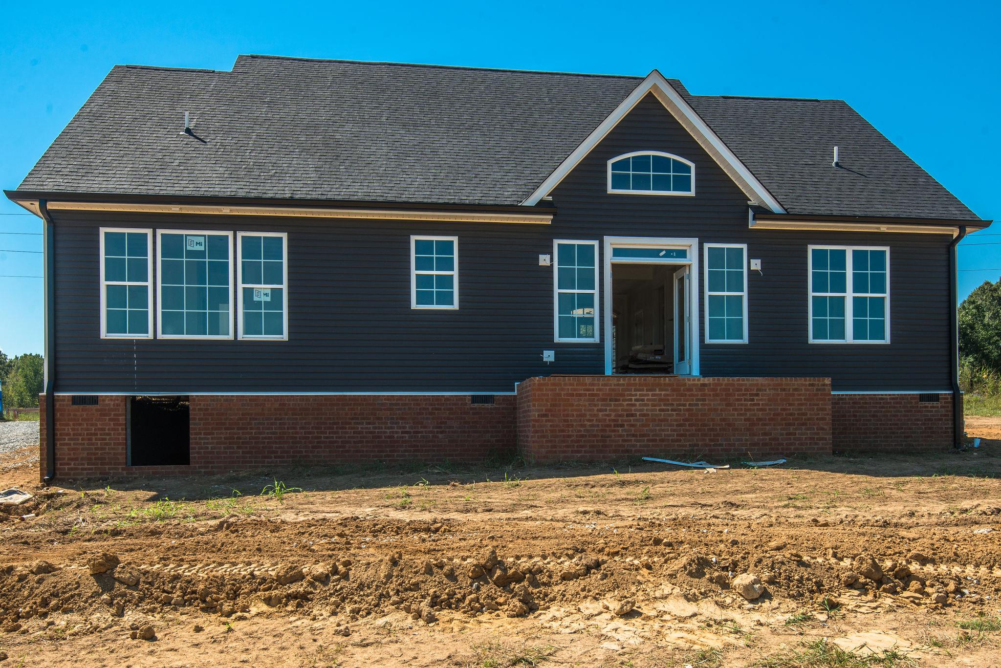 1807 Abiff Road Burns, TN 37029 - Photo 16 of 28 a front view of a house with a yard