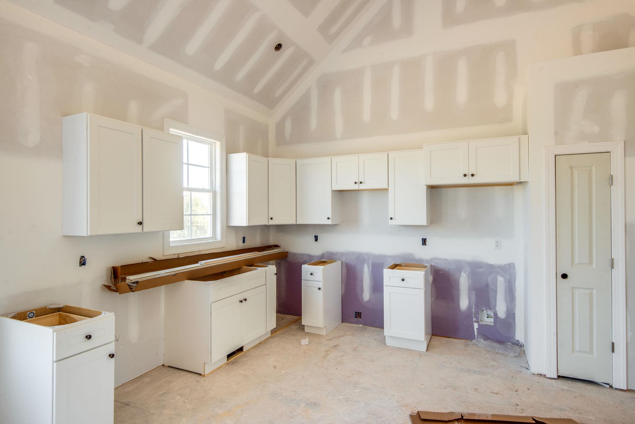 1807 Abiff Road Burns, TN 37029 - Photo 17 of 28 a kitchen that has a lot of cabinets in it and wooden floors