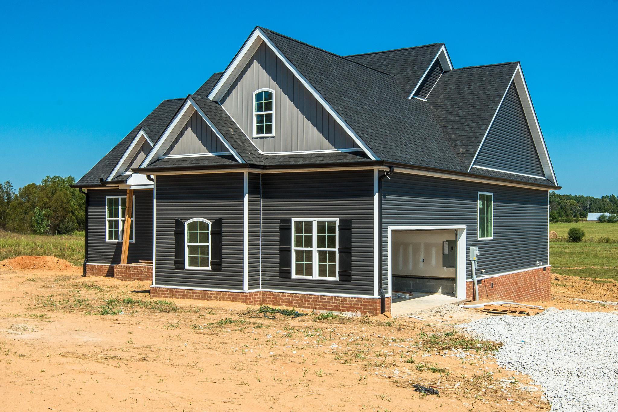 1807 Abiff Road Burns, TN 37029 - Photo 22 of 28 a front view of a house with a yard