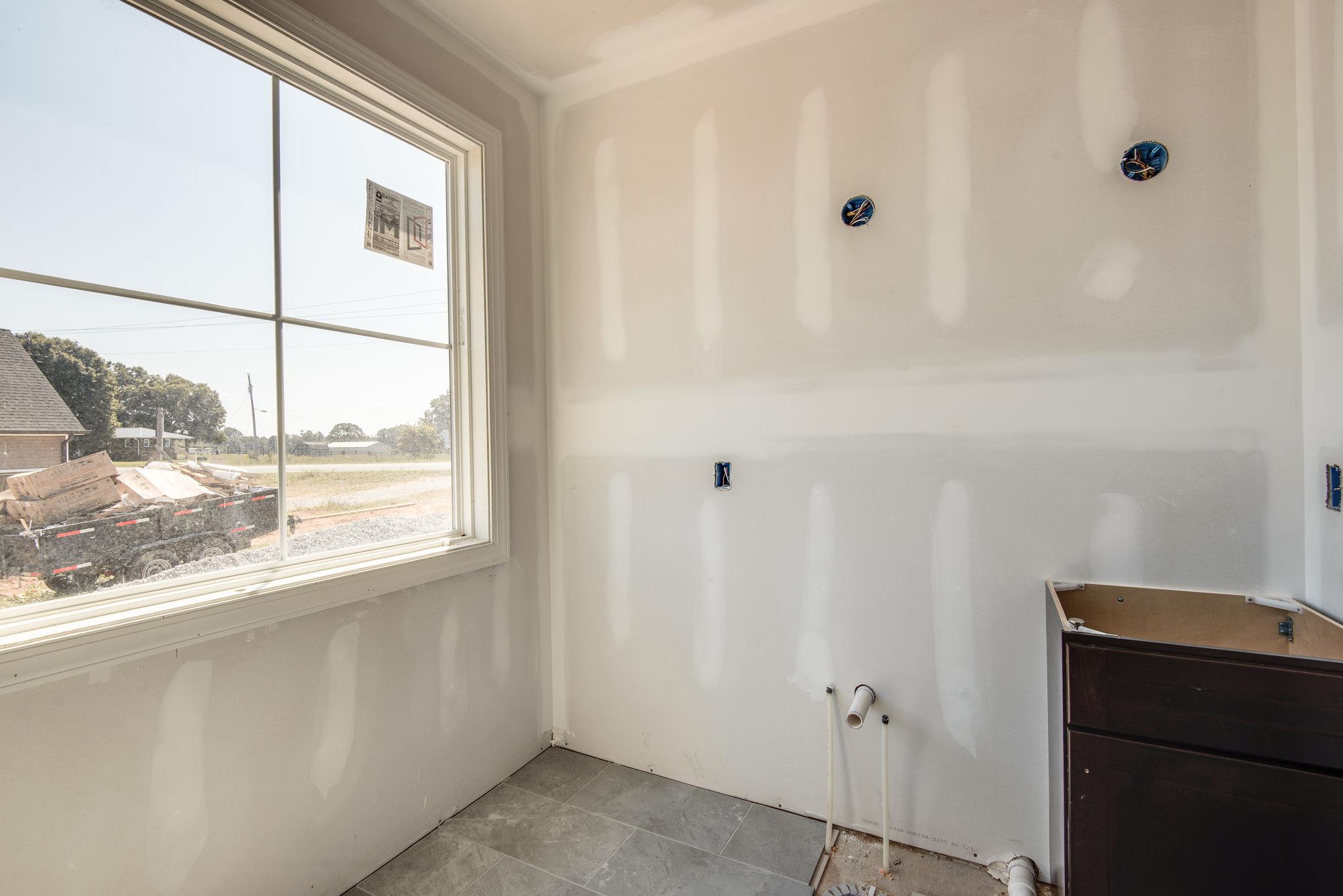 1807 Abiff Road Burns, TN 37029 - Photo 23 of 28 a bathroom with a window and a shower