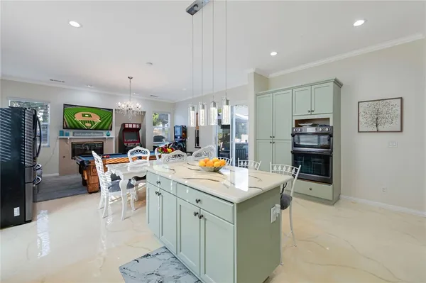 a room with stainless steel appliances lots of counter top space