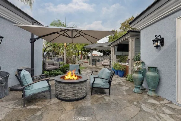 a view of a chairs and table in patio