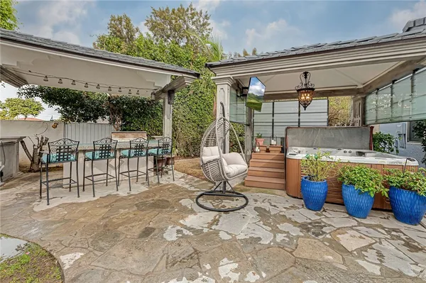 a view of a swimming pool with a patio