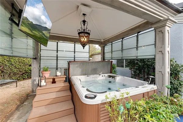 a view of a chairs and table in the backyard