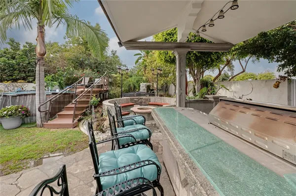 a balcony with table and chairs