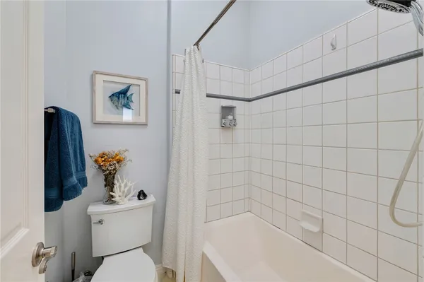 a bedroom with bed and window