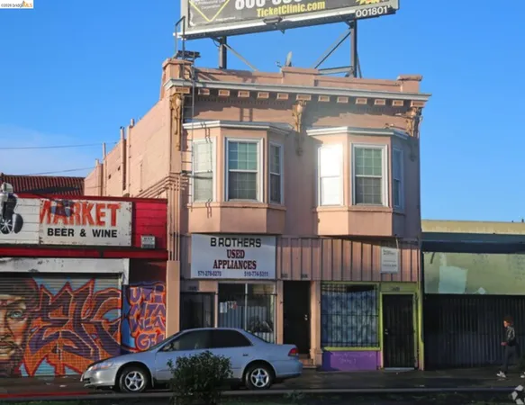 a front view of a building with parking space