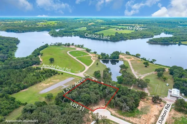 an aerial view of a houses with outdoor space and lake view