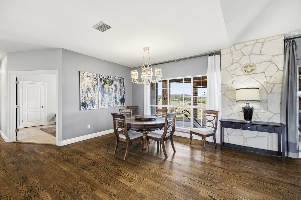 360 Bluff Creek Road North Center Point, TX 78010 - Photo 11 of 64 a living room with furniture and a large window