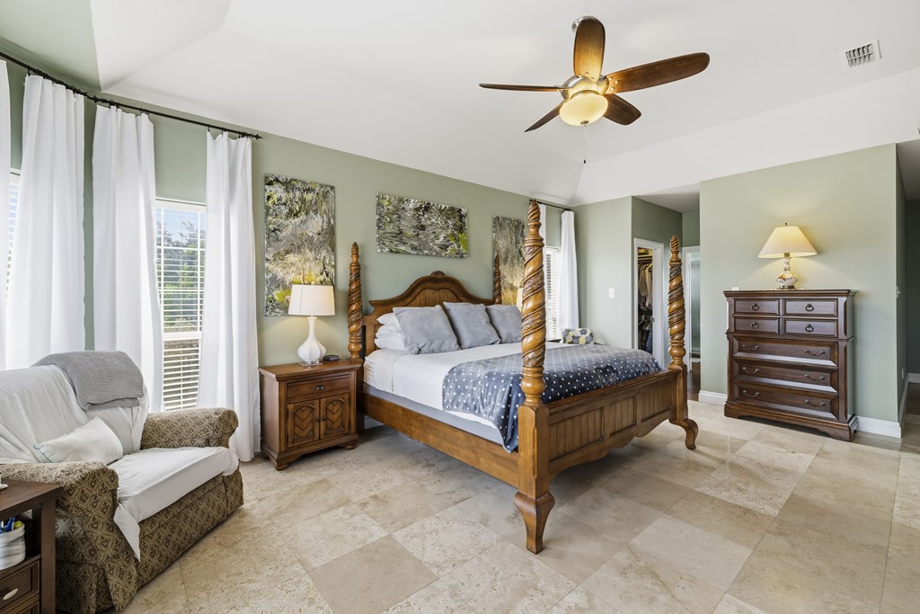 360 Bluff Creek Road North Center Point, TX 78010 - Photo 13 of 64 a bedroom with a bed and a couch