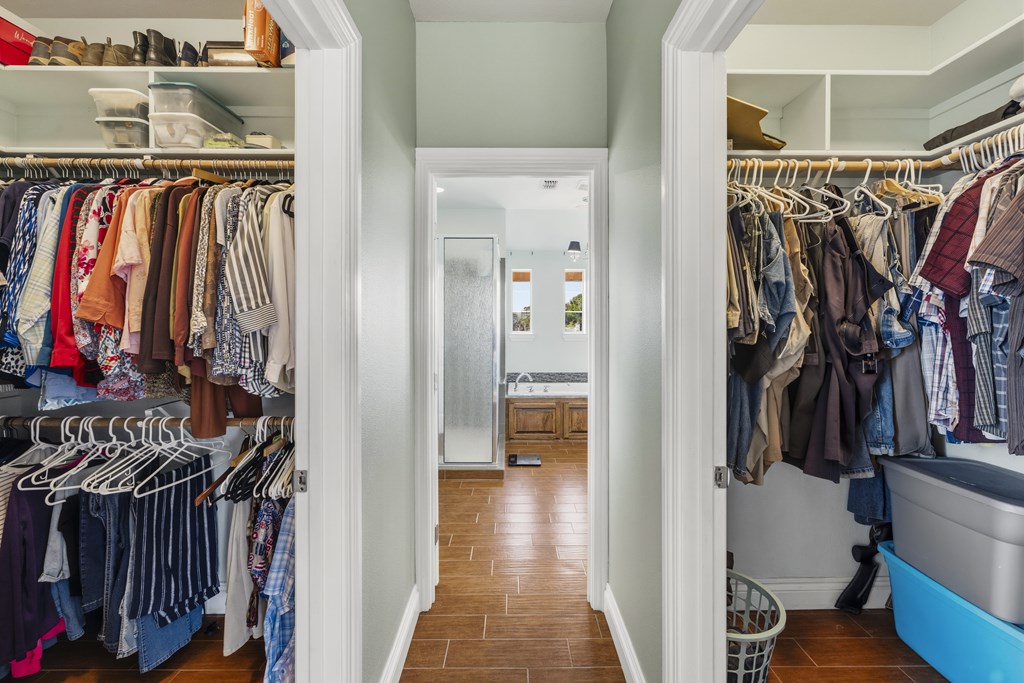 360 Bluff Creek Road North Center Point, TX 78010 - Photo 15 of 64 a view of walk in closet with clothes and shoes