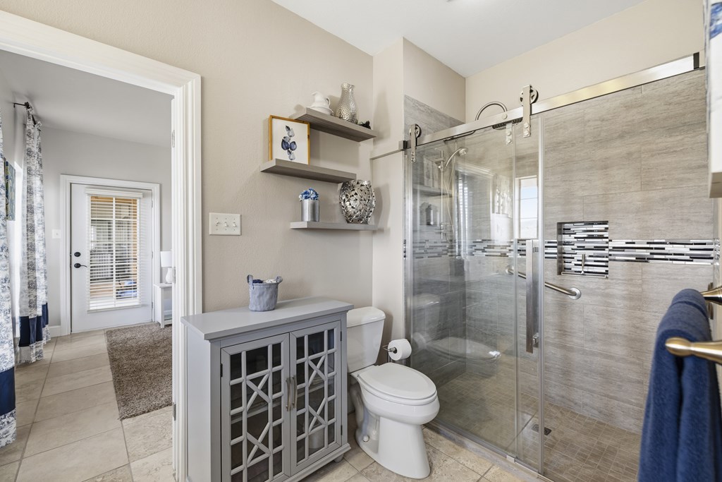 360 Bluff Creek Road North Center Point, TX 78010 - Photo 20 of 64 a bathroom with a sink toilet and shower