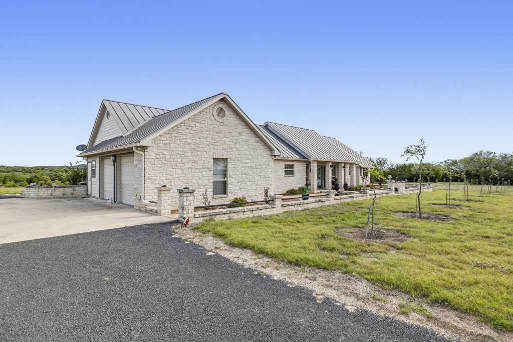 360 Bluff Creek Road North Center Point, TX 78010 - Photo 25 of 64 a view of a house with pool and a yard