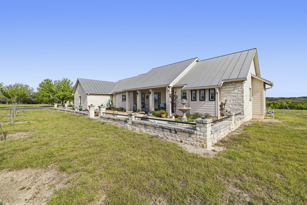 360 Bluff Creek Road North Center Point, TX 78010 - Photo 26 of 64 a view of a house with pool and a yard