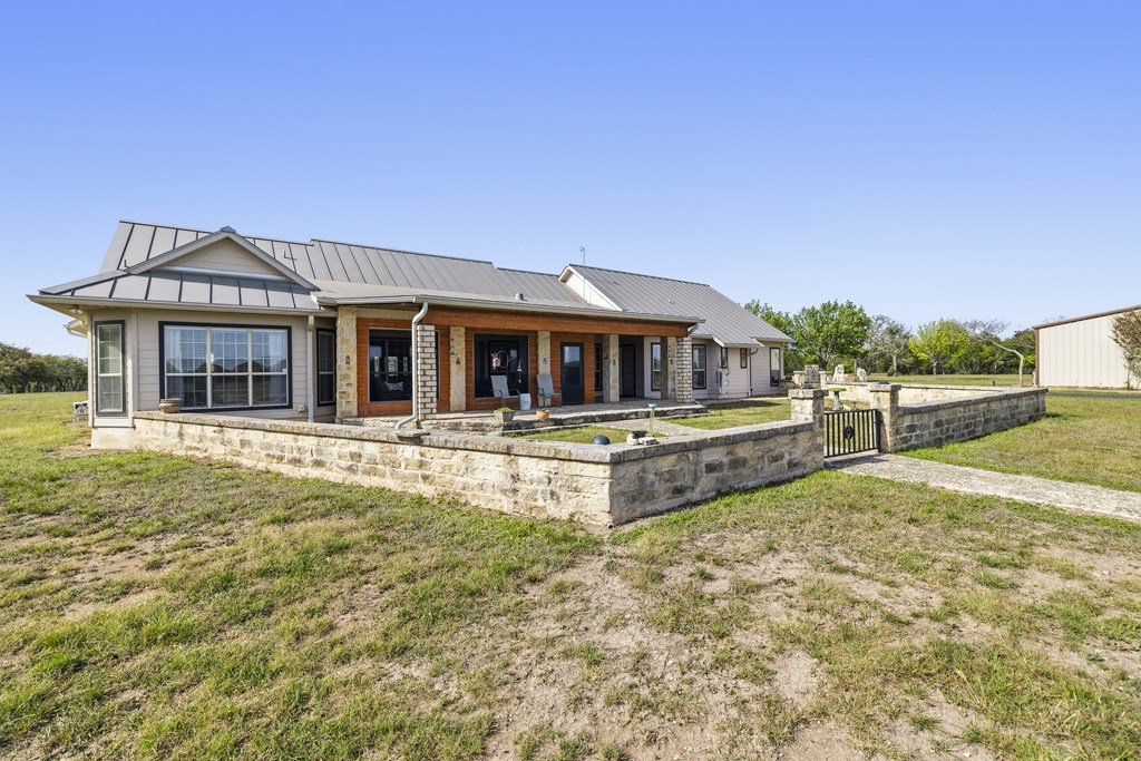 360 Bluff Creek Road North Center Point, TX 78010 - Photo 28 of 64 a house with swimming pool in front of it