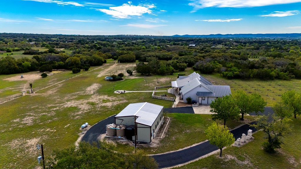 360 Bluff Creek Road North Center Point, TX 78010 - Photo 44 of 64 an aerial view of a house with a garden