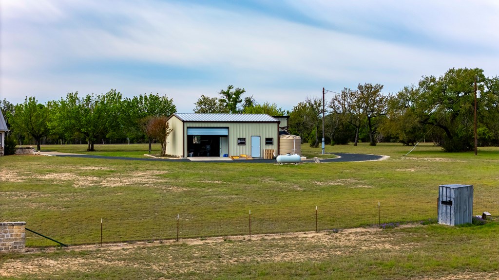 360 Bluff Creek Road North Center Point, TX 78010 - Photo 54 of 64 a view of a swimming pool with a garden