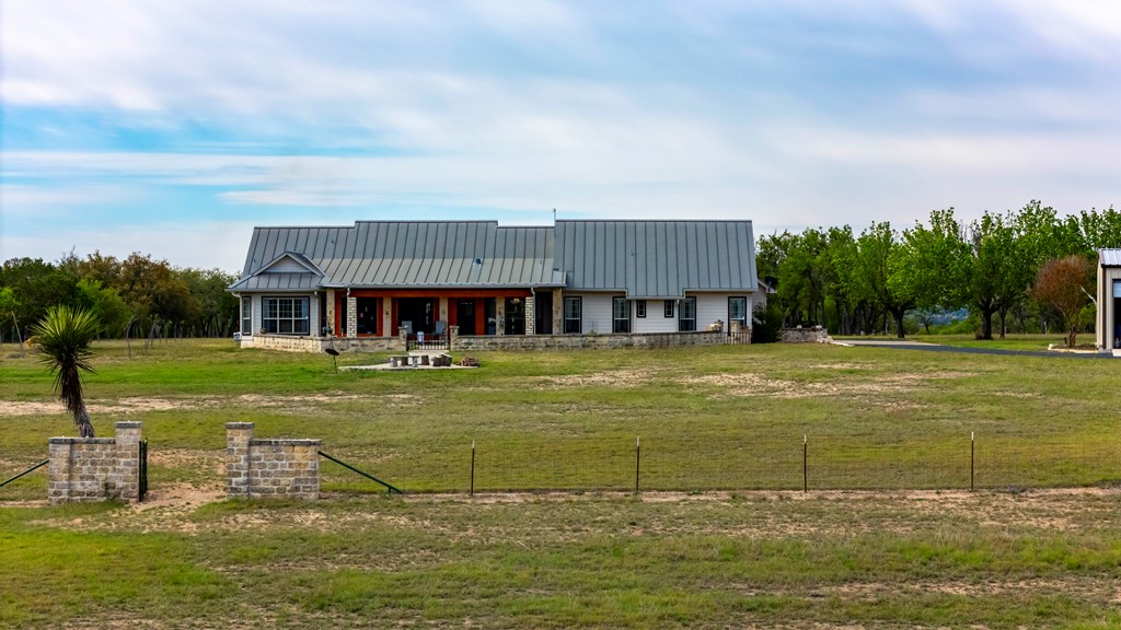 360 Bluff Creek Road North Center Point, TX 78010 - Photo 55 of 64 a view of a swimming pool with a garden and trees