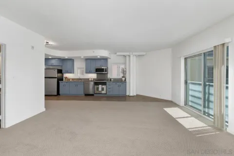 a view of a kitchen with window and stainless steel appliances