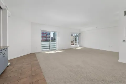 a view of a room has a large window