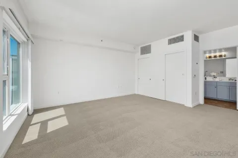 a view of an empty room with a window