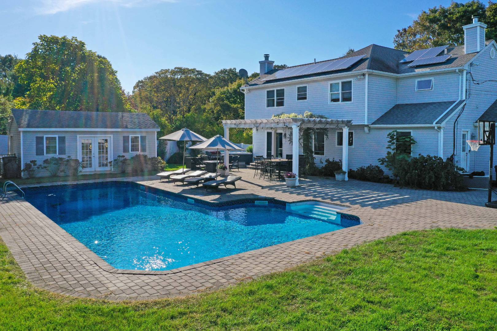 2 Clay Pit Road Remsenburg, NY 11972 - Photo 1 of 19 a view of a house with pool and sitting area