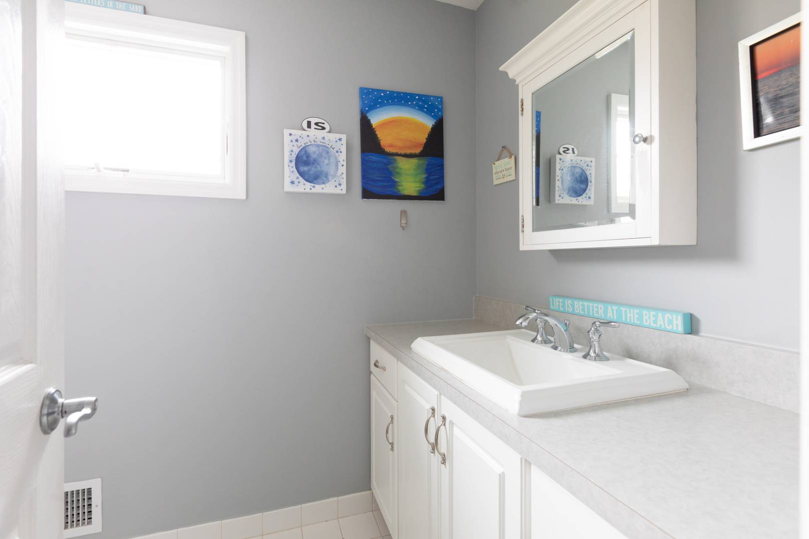 2 Clay Pit Road Remsenburg, NY 11972 - Photo 17 of 19 a bathroom with a sink and a mirror