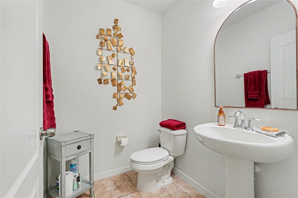 1606 Acadia Harbor Place Brandon, FL 33511 - Photo 14 of 38 a bathroom with a sink toilet and a mirror