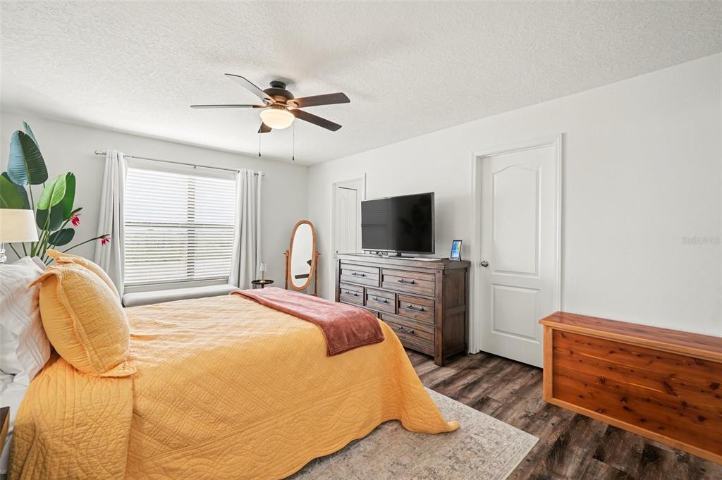 1606 Acadia Harbor Place Brandon, FL 33511 - Photo 17 of 38 a bedroom with a bed and a flat screen tv