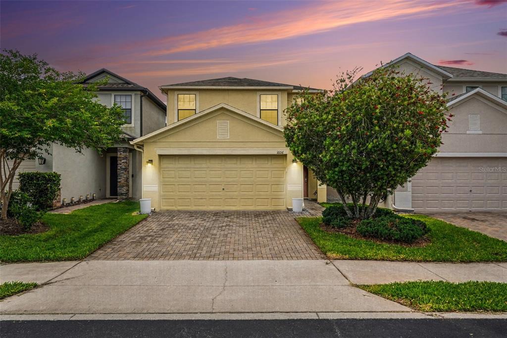 1606 Acadia Harbor Place Brandon, FL 33511 - Photo 35 of 38 a front view of a house with a yard and garage