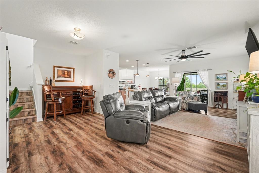 1606 Acadia Harbor Place Brandon, FL 33511 - Photo 7 of 38 a living room with furniture and wooden floor