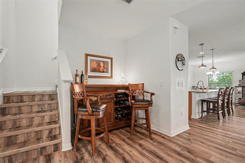 1606 Acadia Harbor Place Brandon, FL 33511 - Photo 8 of 38 a view of a dining room with furniture and wooden floor