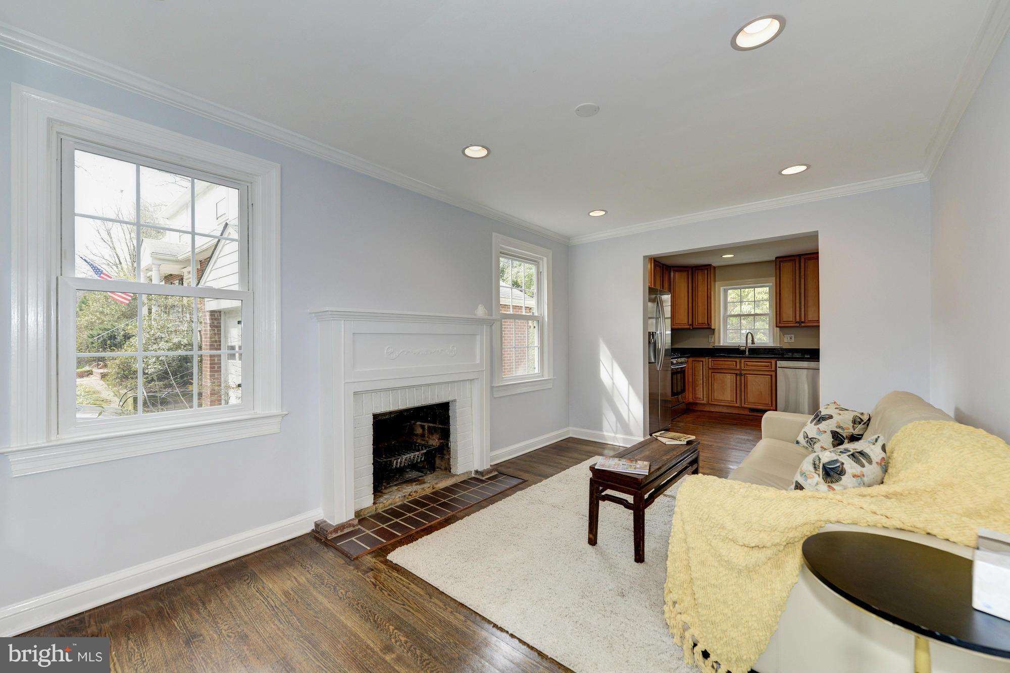 3510 Russell Road Alexandria, VA 22305 - Photo 11 of 30 a living room with furniture a window and a fireplace