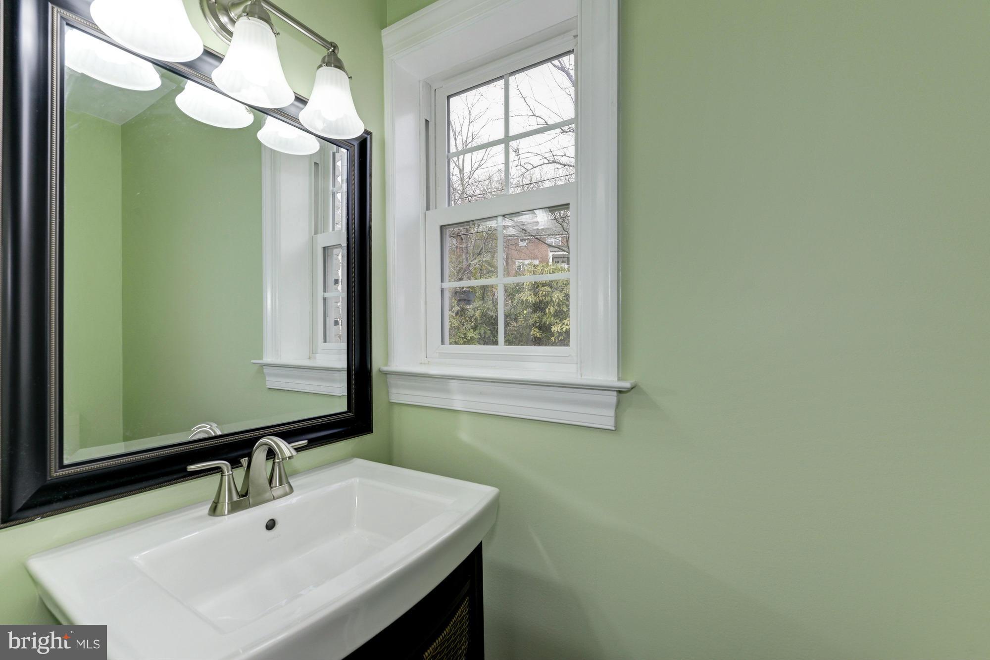 3510 Russell Road Alexandria, VA 22305 - Photo 14 of 30 a bathroom with a sink and a mirror