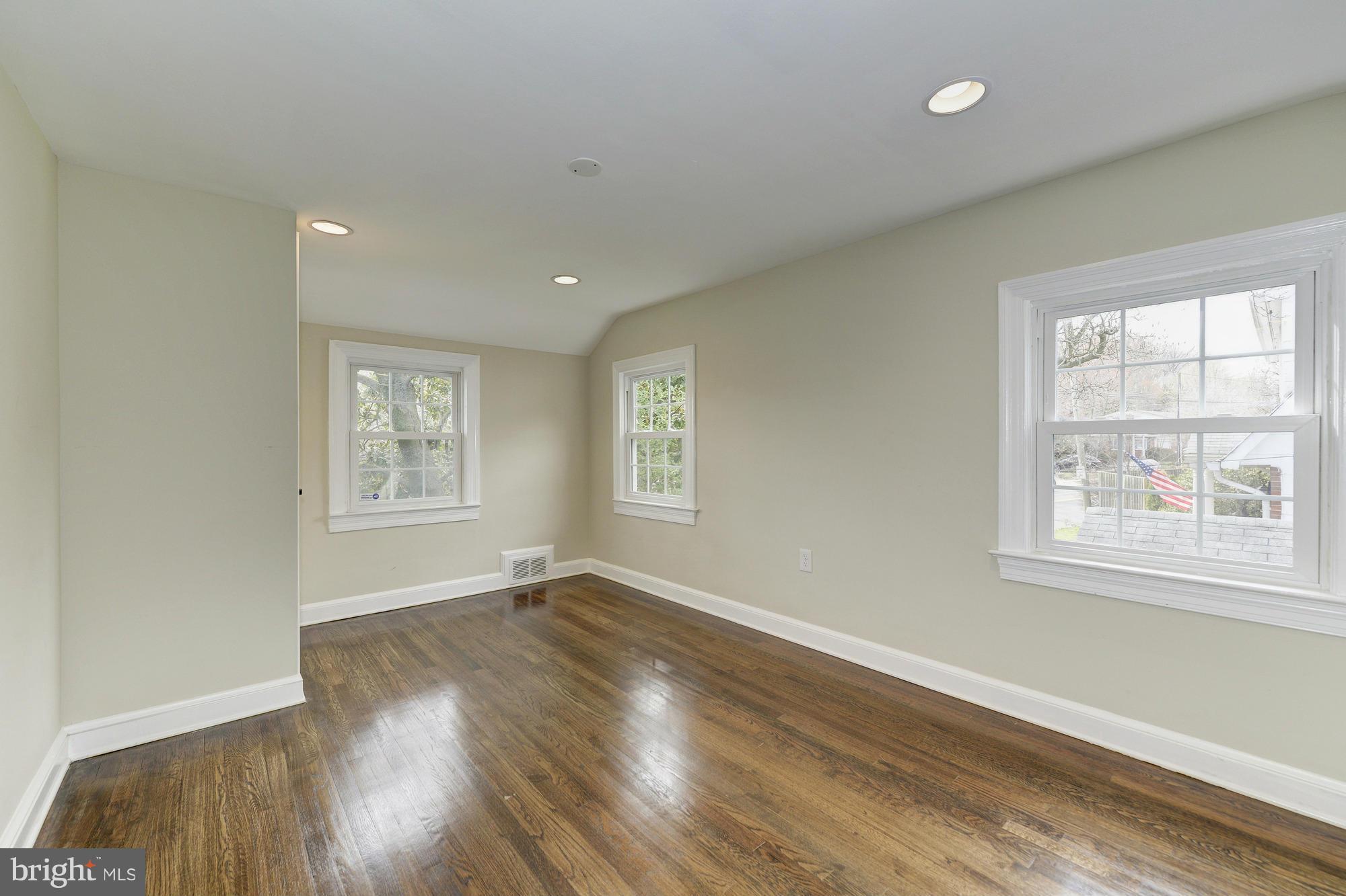 3510 Russell Road Alexandria, VA 22305 - Photo 19 of 30 a view of an empty room with wooden floor and a window