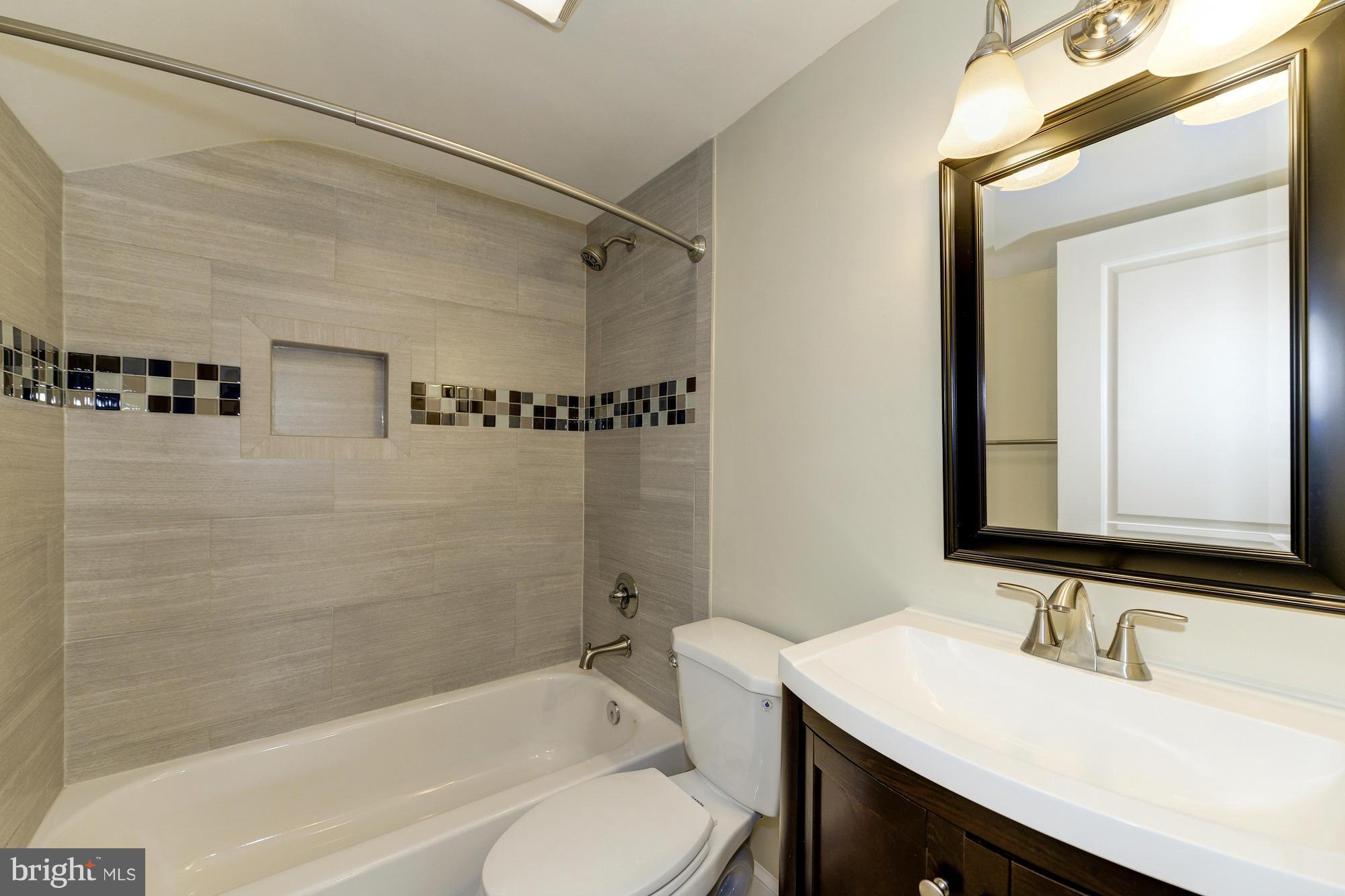 3510 Russell Road Alexandria, VA 22305 - Photo 21 of 30 a bathroom with a sink and a mirror