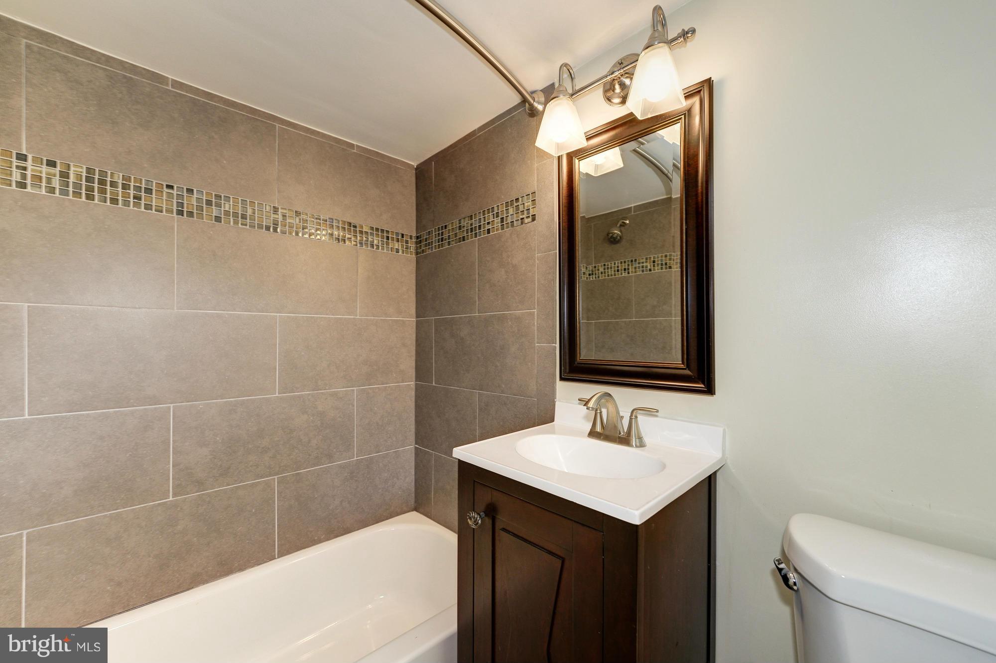 3510 Russell Road Alexandria, VA 22305 - Photo 25 of 30 a bathroom with a sink a toilet and shower