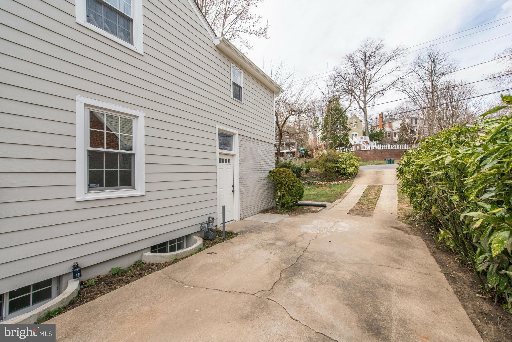 3510 Russell Road Alexandria, VA 22305 - Photo 28 of 30 a view of a house with a yard and potted plants
