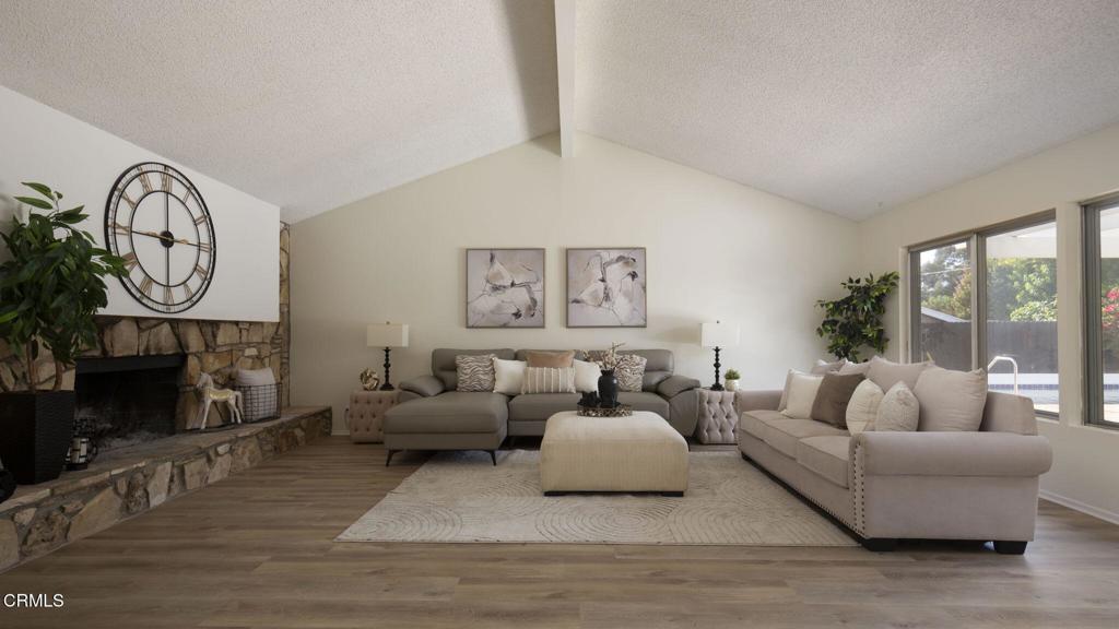 1223 El Encanto Drive Brea, CA 92821 - Photo 7 of 36 a living room with furniture a fireplace and a large window