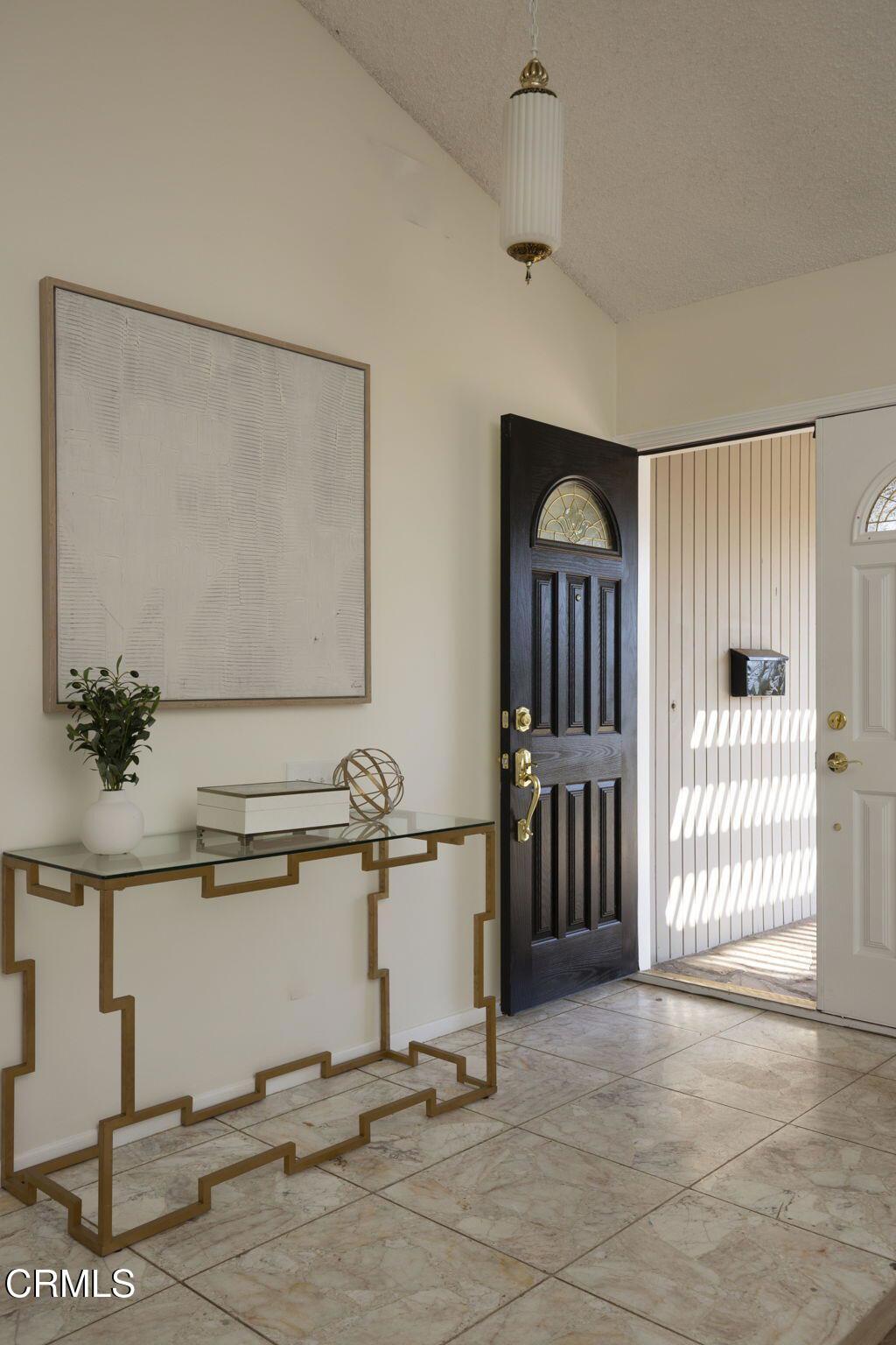 1223 El Encanto Drive Brea, CA 92821 - Photo 8 of 36 a view of a room that has a bed and a table in it