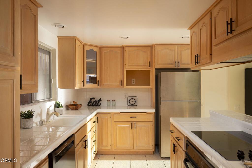 1223 El Encanto Drive Brea, CA 92821 - Photo 10 of 36 a kitchen with a sink a stove and a refrigerator