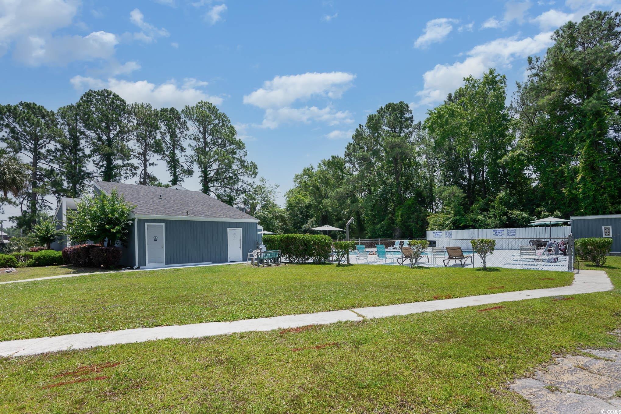 127 Offshore Drive Murrells Inlet, SC 29576 - Photo 40 of 40 View of yard with a community pool